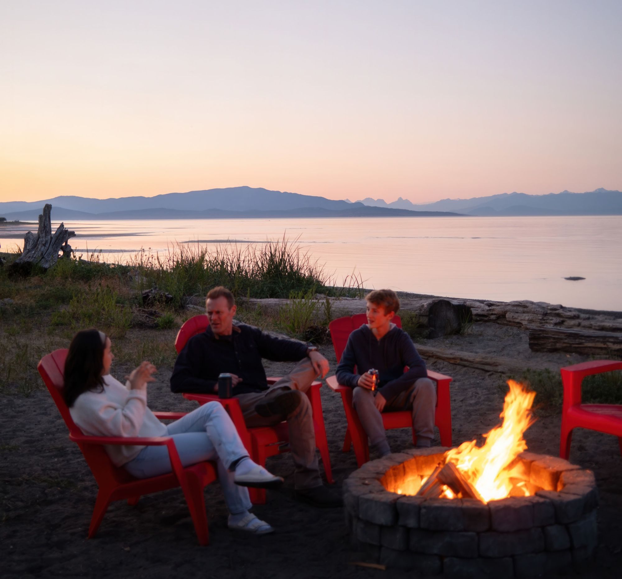 Sharing family fun around a firepit at Beach Acres Resort